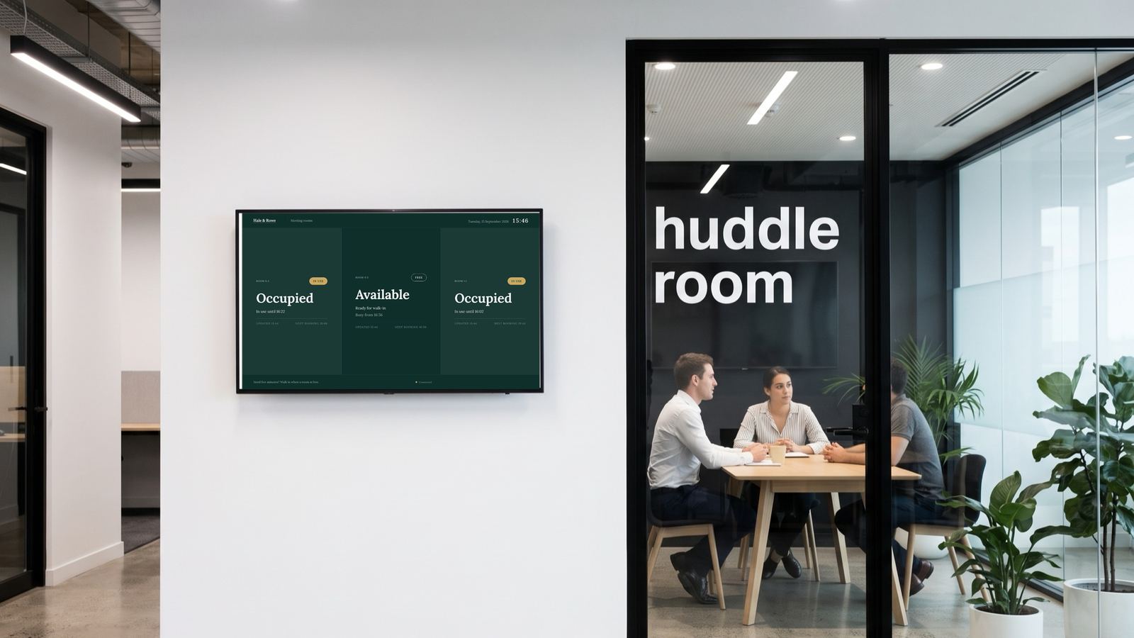 A meeting room corridor: Hale and Rowe's deep green rooms board on the wall beside a glass huddle room