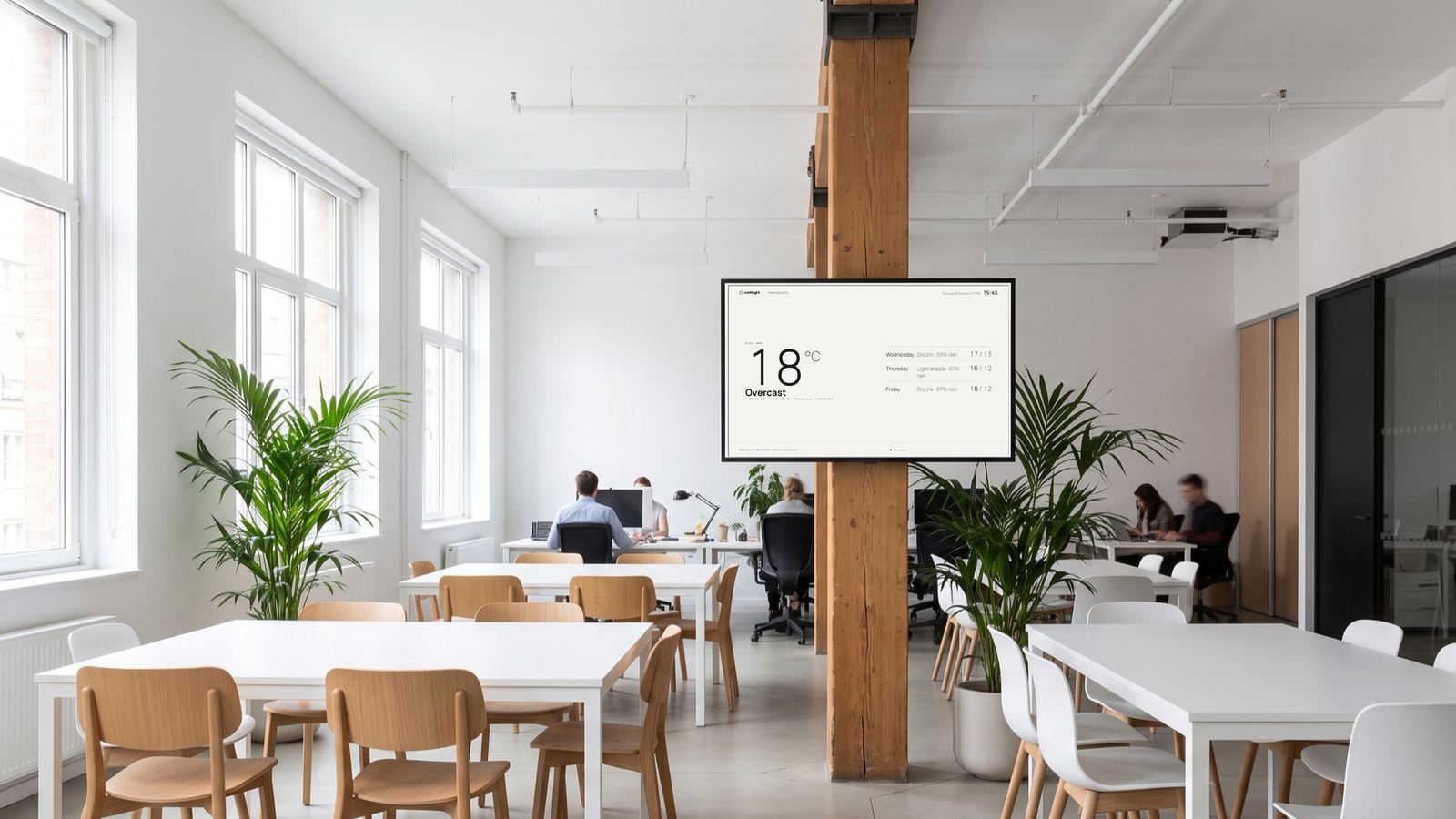 A studio floor with northlight's warm white board on a timber column, showing the weather
